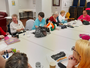 Ladies doing sewing and knitting