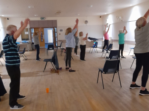 Men and Women doing Yoga